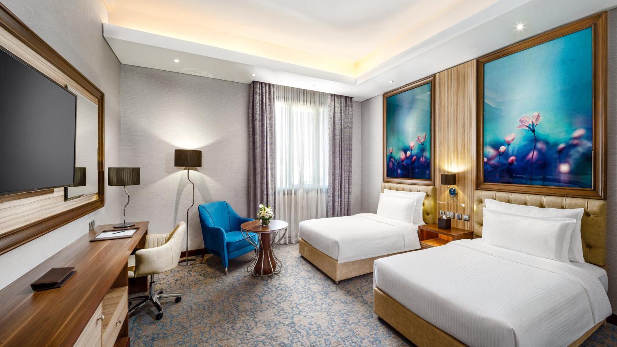 Millennium Place Doha Bagian luar foto Deluxe Room