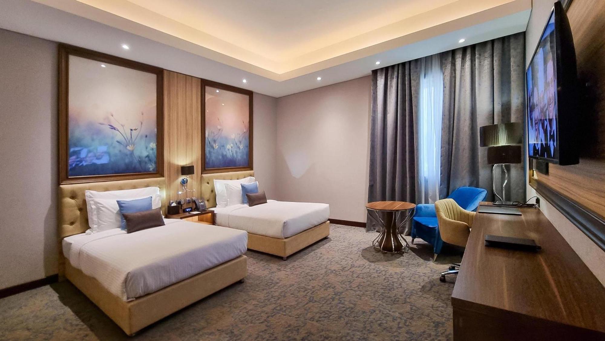 Millennium Place Doha Bagian luar foto Deluxe Twin