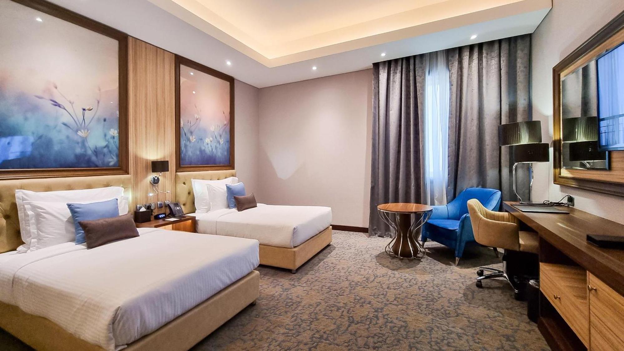 Millennium Place Doha Bagian luar foto Deluxe Room