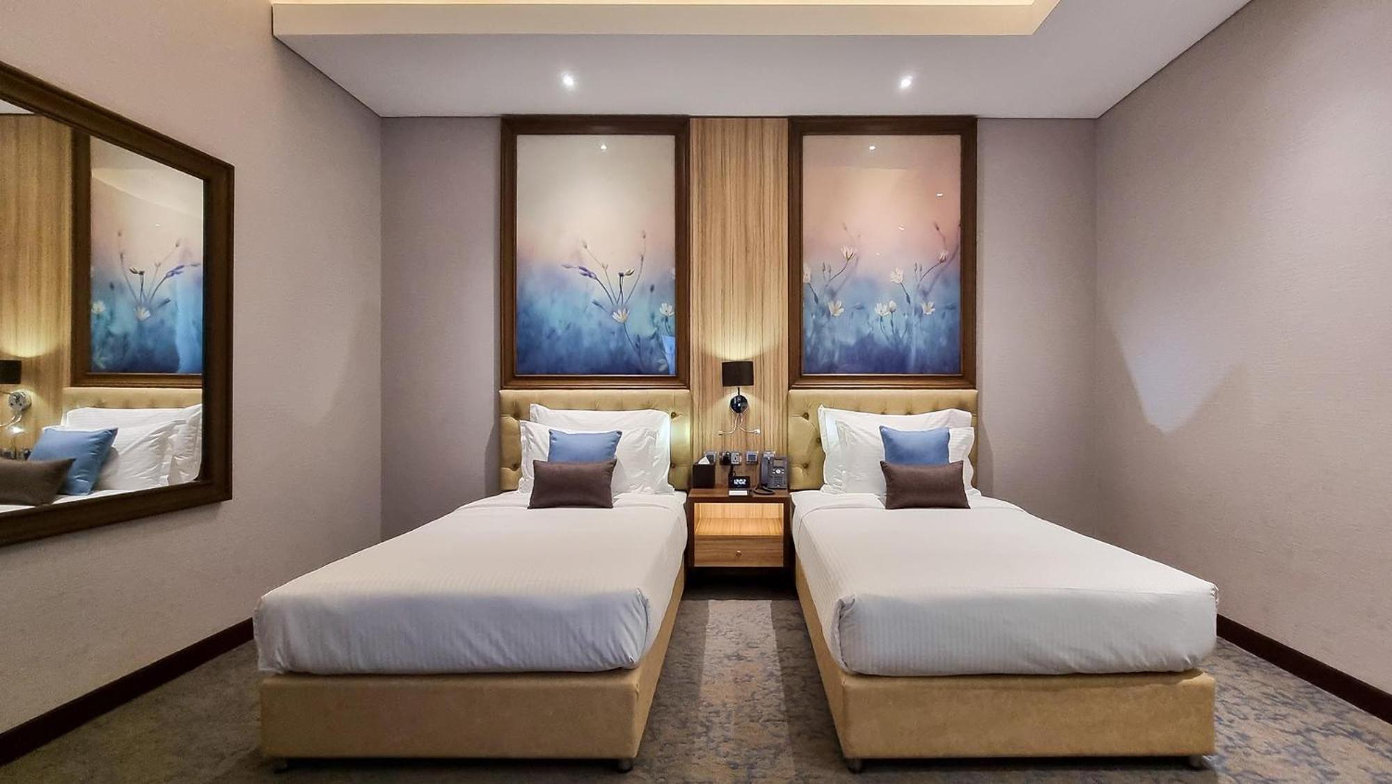 Millennium Place Doha Bagian luar foto Deluxe Twin